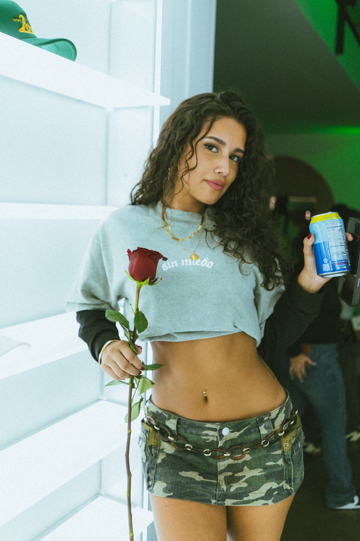 Grey long sleeve crop top, worn, front view