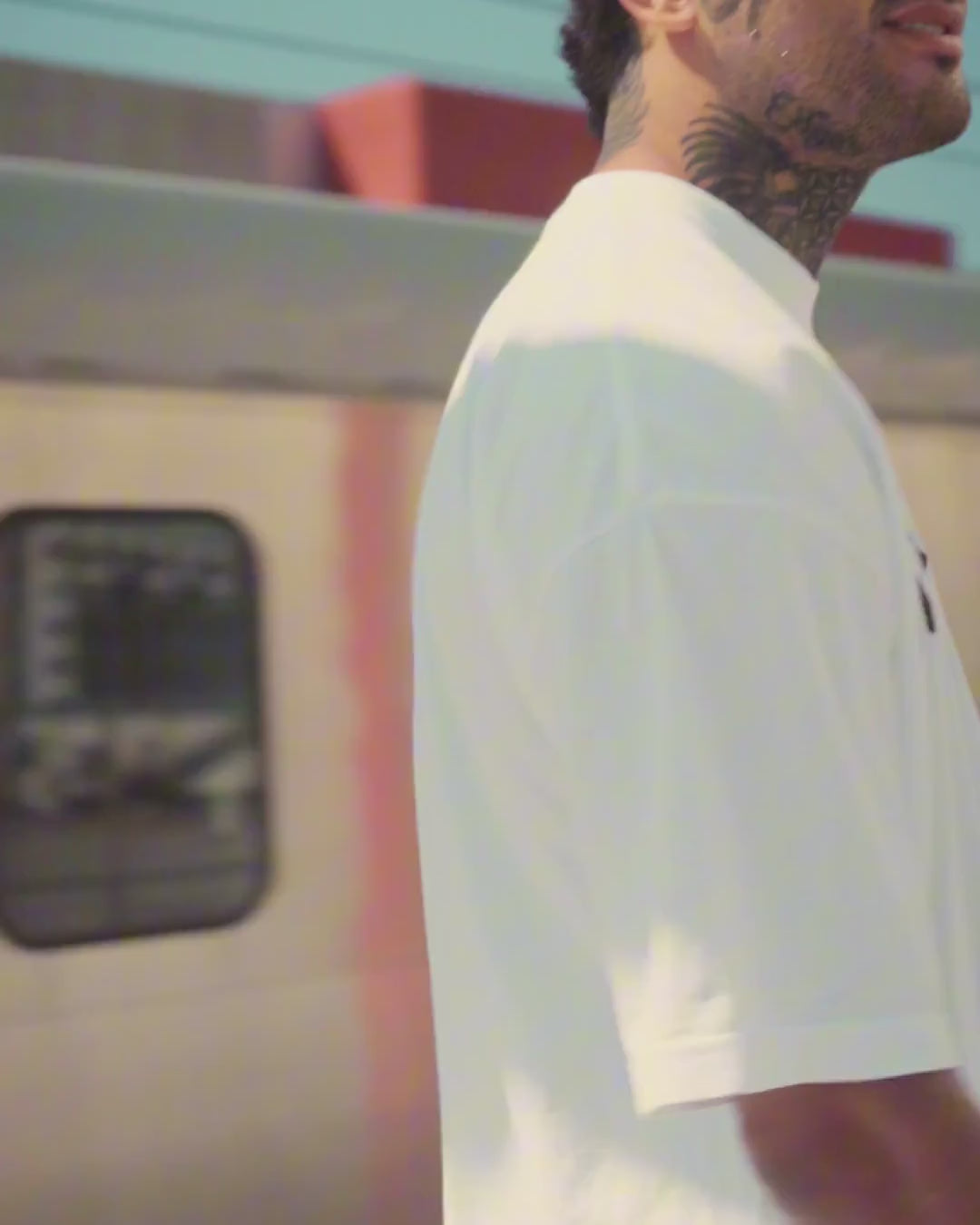 Sin Miedo front logo tee, white, worn at a Metro station